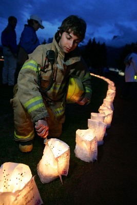 A firefighter lighting luminaries