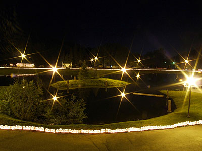 Luminaries line a lake in Campbellton