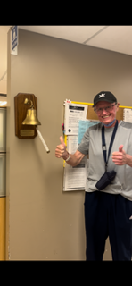 Geoff rining the bell at Michael Garron Hospital