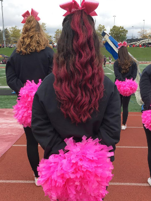 Cheerleading at the "Think Pink' breast cancer awareness football game!